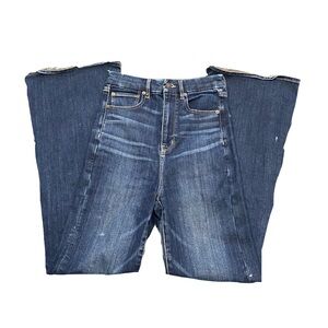 Navy blue high-waisted flare jeans with a distressed finish